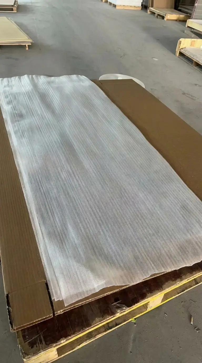 Pallet with non-woven cover